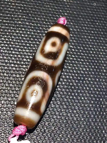 A CINNABAR DZI BEAD