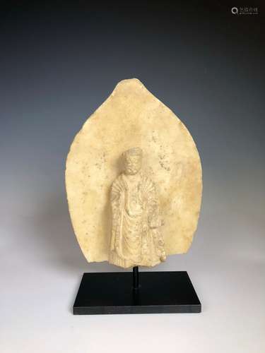 A Carved Stone Figure of Buddha