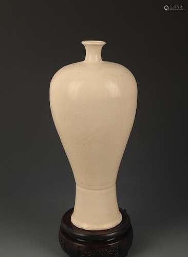 A DING KILN FINELY CARVED MEI STYLE VASE