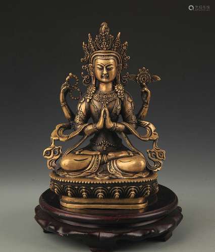 A FINELY CARVED TIBETAN FOUR ARMS GUAN YIN FIGURE