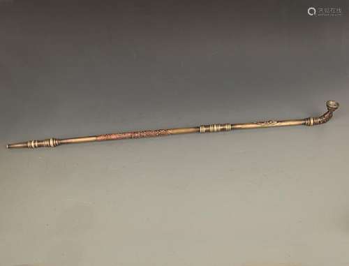 A VERY LONG BRONZE SMOKE PIPE