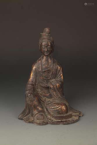 A FINELY CARVED IRON CAST GUAN YIN FIGURE