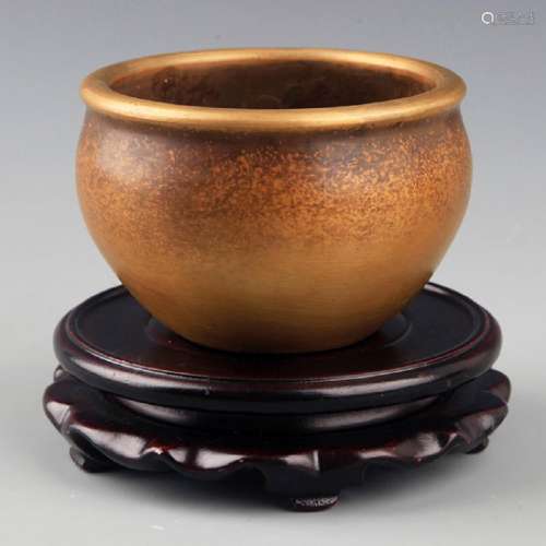 A SMALL AND ROUND BRONZE INCENSE BURNER