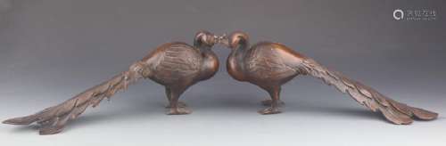 A PAIR OF BRONZE PEACOCK