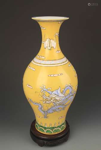 A YELLOW GROUND FAMILLE ROSE DRAGON PATTERN VASE