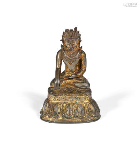 Probably Burma, 17th century or earlier A gilt bronze figure of Shakyamuni