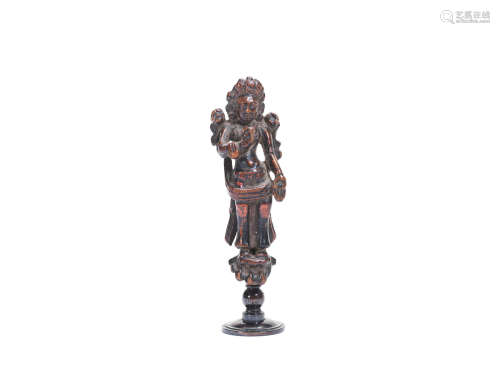 Tibet or Nepal, probably 12th century A lacquered wood figure of a standing Bodhisatttva