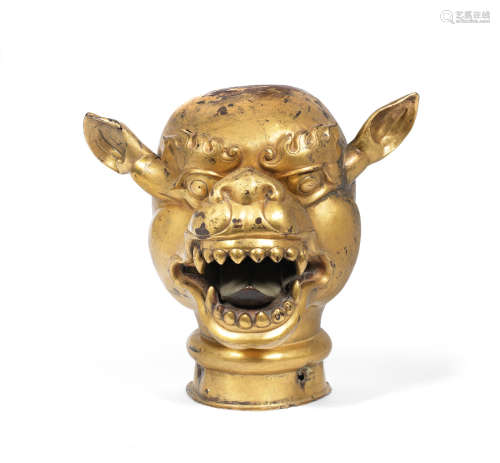 18th century A large repoussé gilt-copper head of a mythical beast