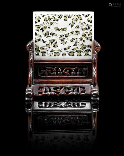 Ming Dynasty A rectangular pale green jade 'dragon' plaque