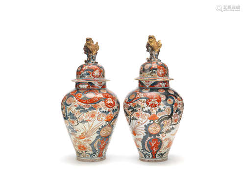 18th century A pair of Imari baluster vases and covers