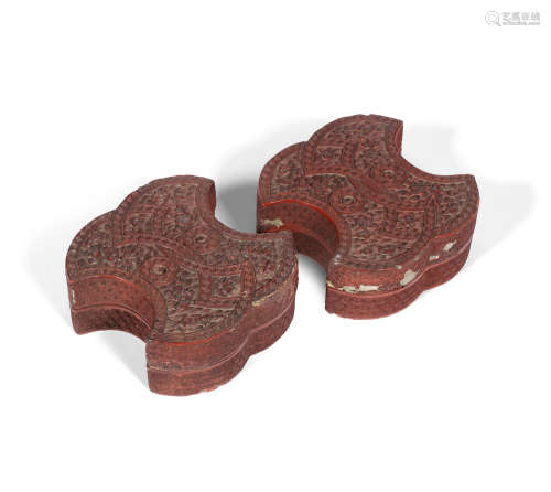 Qianlong A pair of cinnabar lacquer 'double-ingot' boxes and covers