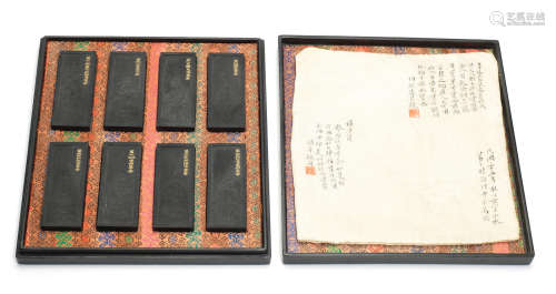 20th century A set of eight 'luohan' ink cakes and lacquered presentation box.