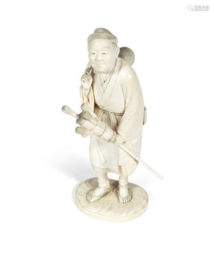 Signed Munetoshi, Meiji Period An ivory okimono of a tea whisk seller