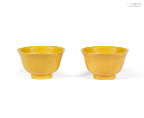 Guangxu six-character marks and of the period A PAIR OF YELLOW-GLAZED INCISED 'DRAGON' BOWLS