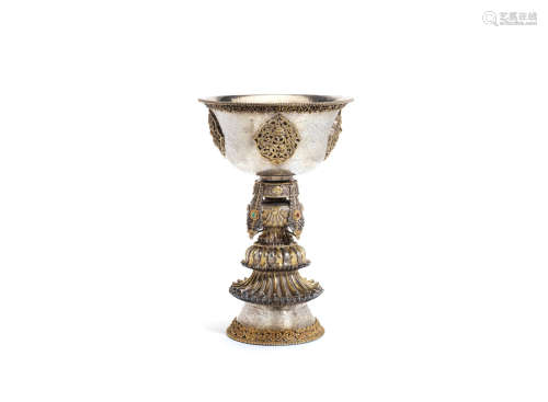 Tibet, 19th century A parcel-gilt silver butter lamp