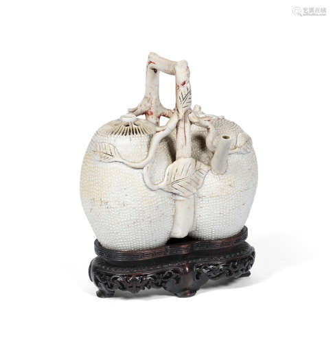 18th century A rare biscuit-fired 'conjoined peach' teapot and cover