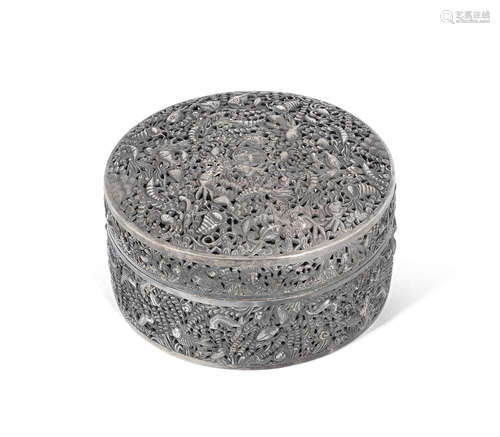 19th/20th century A reticulated repoussé white-metal circular box and cover