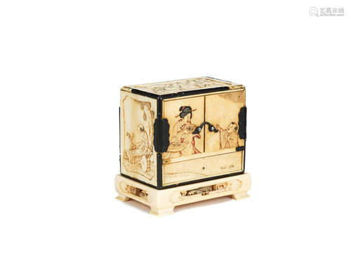 Meiji Period A small carved ivory kodansu and stand