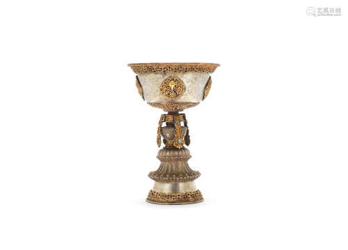 Tibet, 19th century  A parcel-gilt silver butter lamp