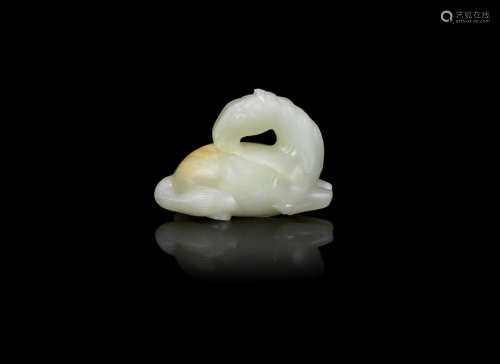 Qing Dynasty A pale green jade recumbent horse carving
