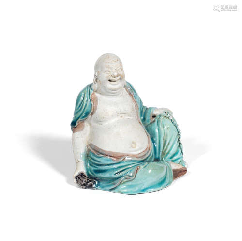 Kangxi A turquoise and aubergine-glazed biscuit figure of Budai