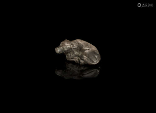 Ming Dynasty A mottled grey and brown jade carving of a recumbent buffalo