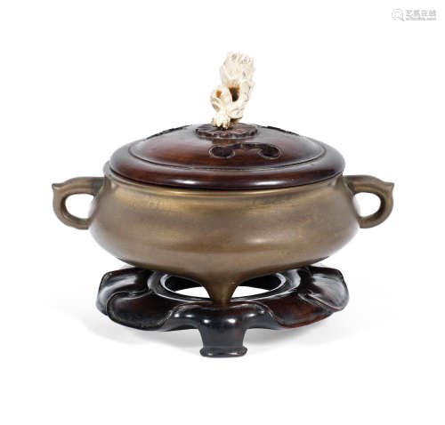Xuande six-character mark, 17th century  A bronze tripod incense burner