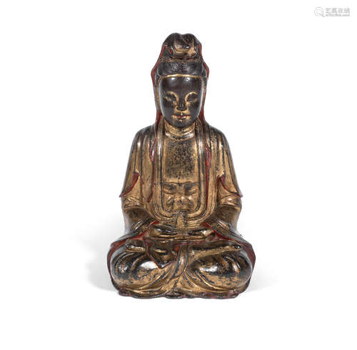 16th/17th century A gilt lacquered bronze figure of Guanyin