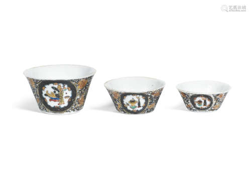 Yongzheng six-character marks and of the period A rare part set of gilt and grisaille enamelled 'Hundred Antiques' wine cups