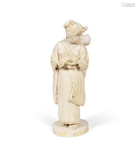 Signed, Meiji Period A Tokyo School ivory okimono of a standing lady