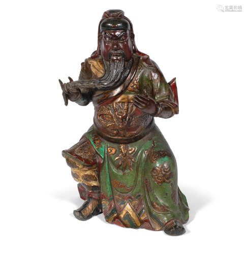 Xuande six-character mark, 19th/20th century A polychrome bronze figure of Guandi