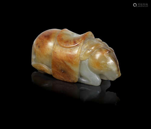 Late Ming Dynasty A pale green and russet jade carving of a recumbent horse