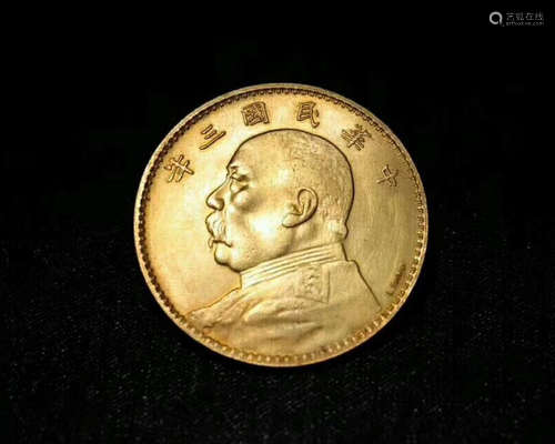 A GOLD COMMEMORATIVE COIN