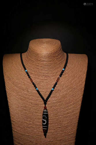 AN OLD DZI BEAD NECKLACE