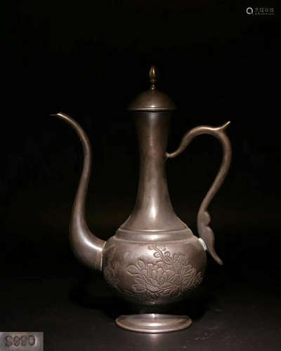 A CARVED SILVER FLOWER EWER