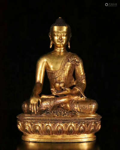 A GLIT-BRONZE FIGURE OF BUDDHA