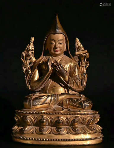 A GLIT-BRONZE FIGURE OF BUDDHA