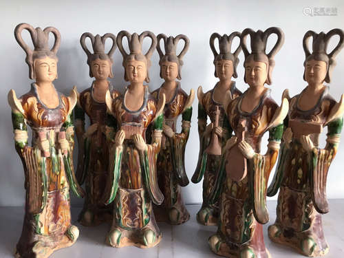 SEVEN PAINTED POTTERY OF LADY FIGURES