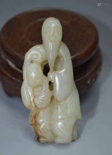 A JADE STONE FIGURE