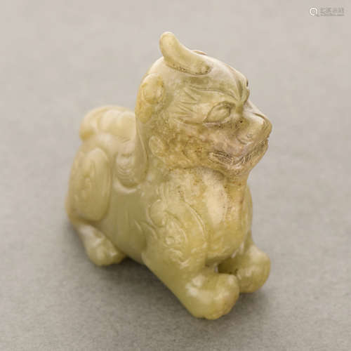 CHINESE YELLOW AND RUSSET JADE CARVING OF A BEAST