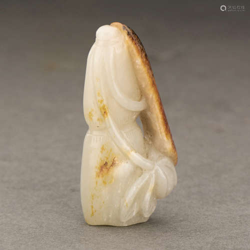 A CHINESE WHITE AND RUSSET JADE LOTUS