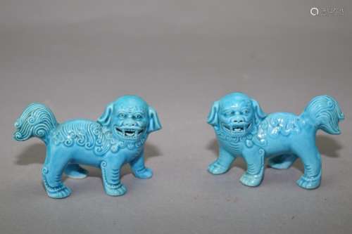 Pair of Chinese Peacock Blue Glaze Lions