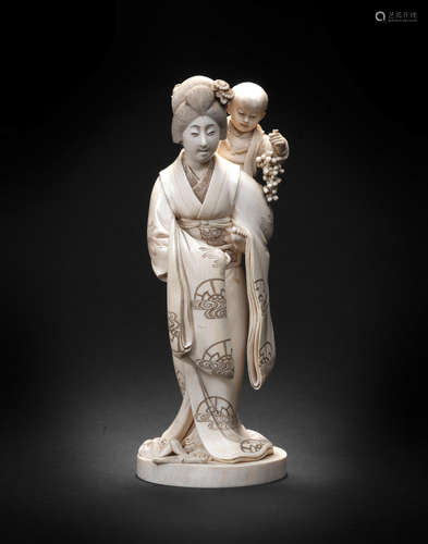 By Suzuki Nobuyoshi, Meiji era (1868-1912), early 20th century An ivory okimono figure of a mother and child