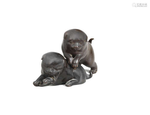 By Morimitsu, Meiji era (1868-1912), late 19th/early 20th century A bronze okimono group of two plump puppies