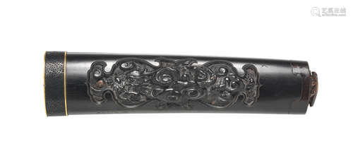 By Sasaki Tomiaki, Iwami Province, Edo period (1615-1868), early to mid 19th century A rare carved ebony tsuka (sword hilt)