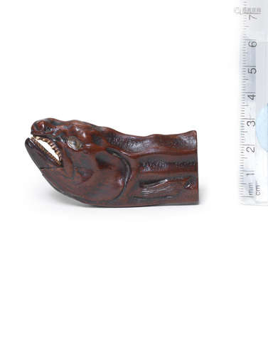 By Miwa, Edo period (1615-1868), early 19th century A wood netsuke of a desiccated salmon head