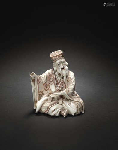 By Tokosai Tomotoshi, Meiji era (1868-1912), late 19th/early 20th century A stained ivory seated figure of a scholar