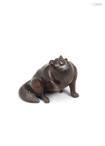 By Yukimori, Meiji era (1868-1912), late 19th/early 20th century A bronze okimono of a tanuki (rancoon dog)