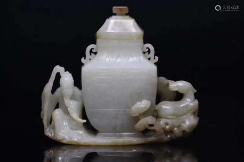 AN OLD TIBETAN HETIAN JADE VASE WITH THE GOD OF LONGEVITY AND ANIMALS