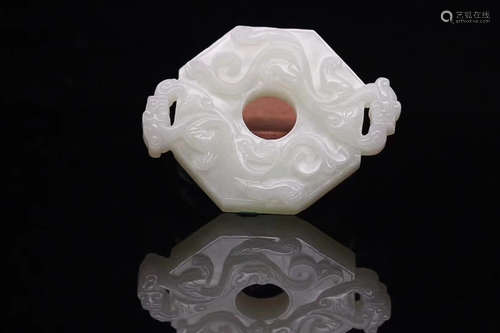 AN OLD TIBETAN HETIAN JADE SEED MATERIAL HIGH RELIEF OCTAGONAL PENDANT